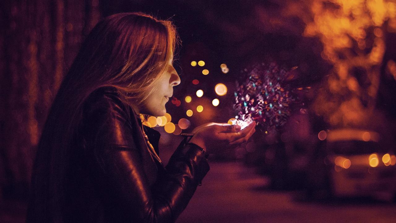 woman blowing magic from hands representing marketing expectations vs. reality