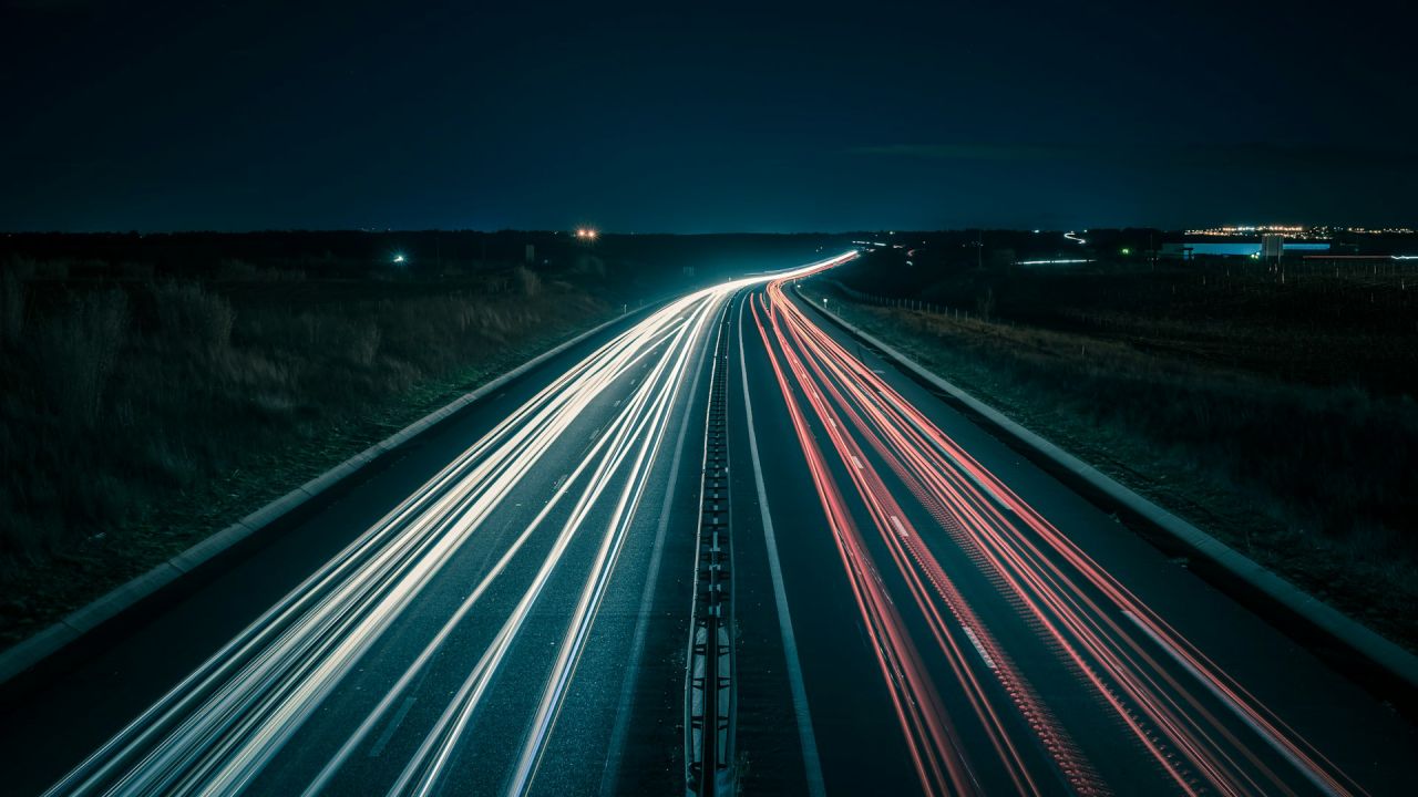 speeding up lead generation represented by timelapse of car lights on a highway